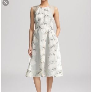 Whistles dress in organza palm print.